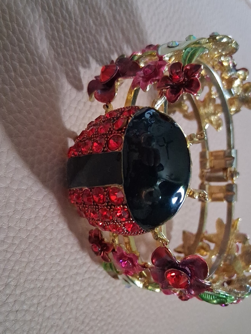Gold-Tone Floral Bracelet with Red and Black Gemstone Accent